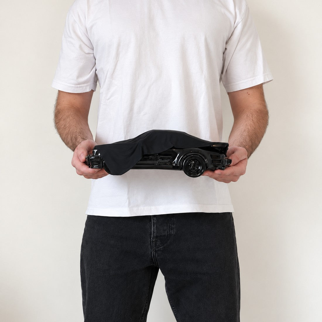 Black Memory in Large (30 cm), held in two hands to show its real size