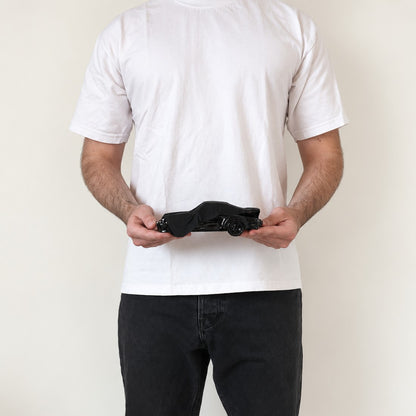 Black Memory in Medium (19 cm), held in two hands to show its real size